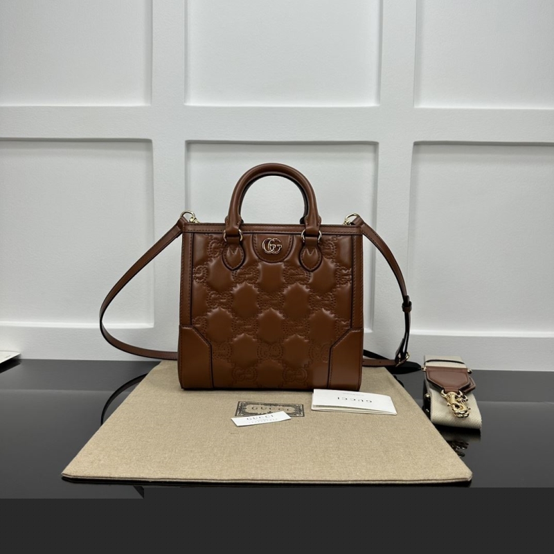 G*u*i top handle bags